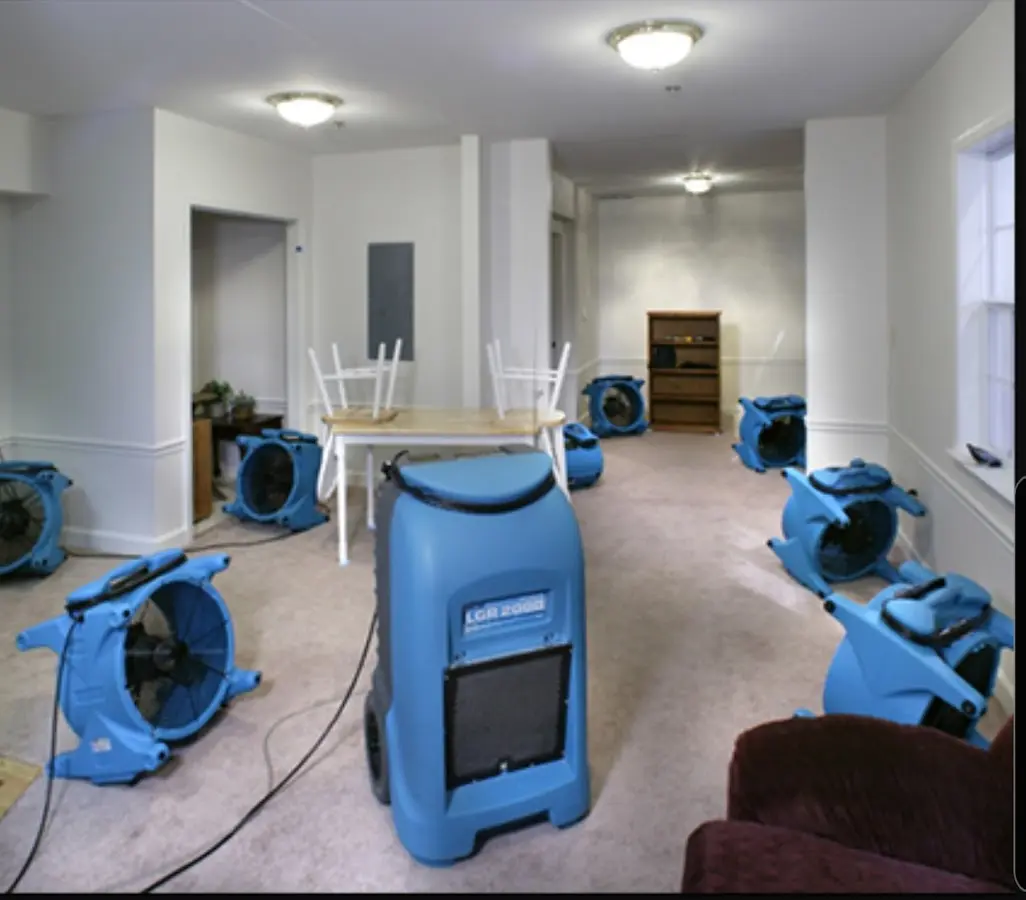 Air movers and dehumidifier setup for Water Damage Restoration in Peters
